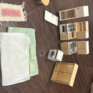 Collection of dollhouse furniture and linens/curtains
